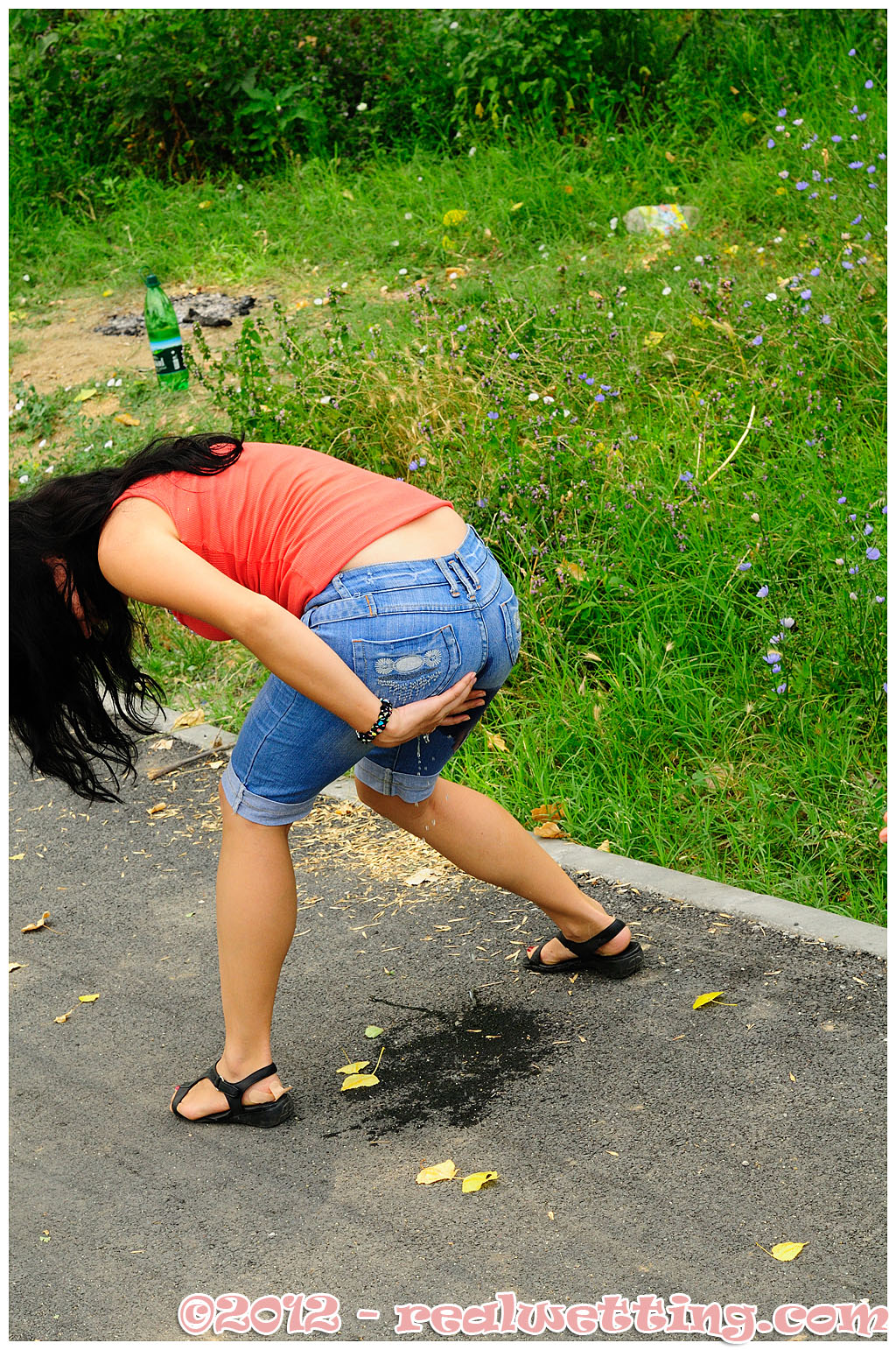 Woman peeing very far